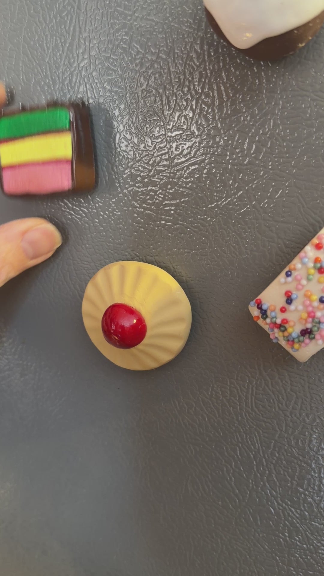 Italian Cookie Magnets close up on fridge.